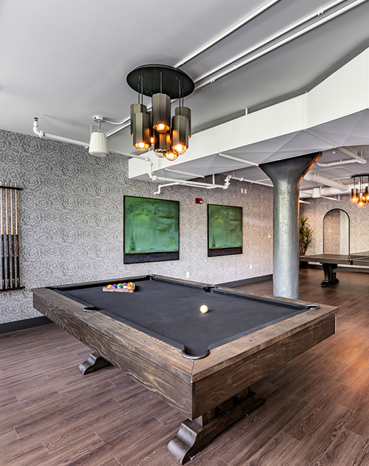 Game room with hardwood floors and pool tables